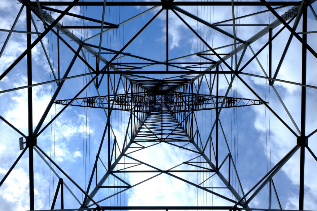A view of a cell tower from directly underneath, looking towards the sky