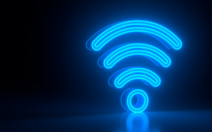 A neon wifi symbol against a dark background