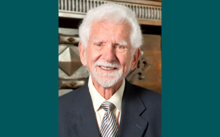 Martin Cooper headshot against a teal background